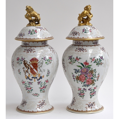 342 - A pair of Samson famille rose and armorial baluster vases and covers, with gilt kylin knops, 40cmH

... 