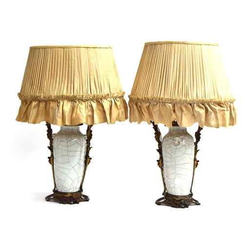 360 - A pair of Chinese ormolu mounted crackle glaze vases, each with dragon handles, adapted as lamps, wi... 