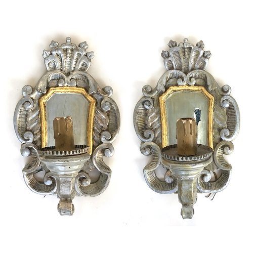 373 - A pair of Italian parcel gilt and silver gesso wall sconces, fitted for electricity, each 59cmH

Pro... 