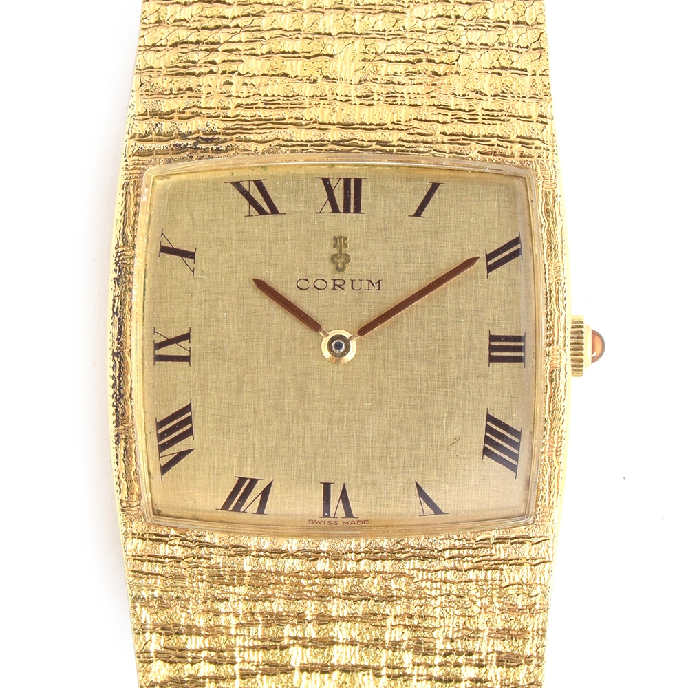 A FINE GENTLEMAN S 18CT SOLID GOLD CORUM SPARTACUS BRACELET WATCH