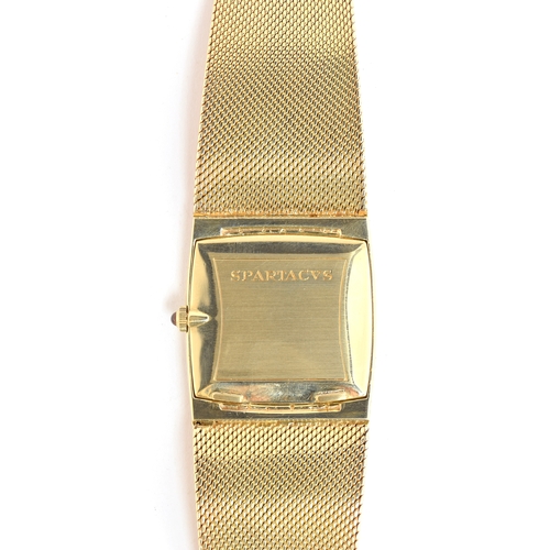 104 - A FINE GENTLEMAN'S 18CT SOLID GOLD CORUM SPARTACUS BRACELET WATCH
CIRCA 1970, REF 8828, CHAMPAGNE DI... 