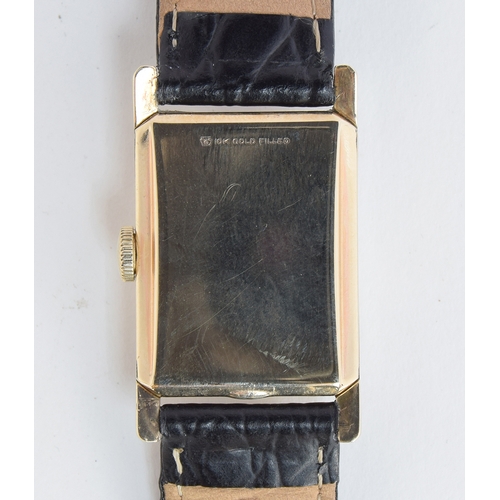 118 - A GENTLEMAN'S 10CT GOLD FILLED RECTANGULAR LONGINES - Wittnauer WRIST WATCH
CIRCA 1950s, SILVERED DI... 