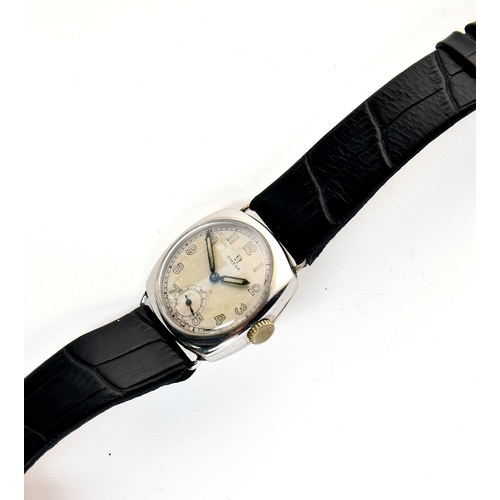 58 - A GENTLEMAN'S STAINLESS STEEL OMEGA WRIST WATCH
DATED 1934, parchment dial with arabic numerals, rai... 