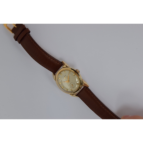 66 - A GENTLEMAN'S 10K GOLD FILLED LONGINES WRIST WATCH
CIRCA 1950s, parchment dial with sub second subsi... 