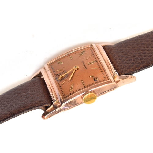 68 - A 10CT GOLD FILLED LONGINES WRIST WATCH
*BROKEN CRYSTAL*
CIRCA 1940s, REF 7324448, COPPER DIAL WITH ... 