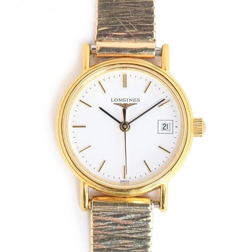 74 - A LADIES STAINLESS STELL AND GOLD PLATED LONGINES WRIST WATCH 
A LADIES MARC FAVRE 9CT GOLD WATCH *B... 