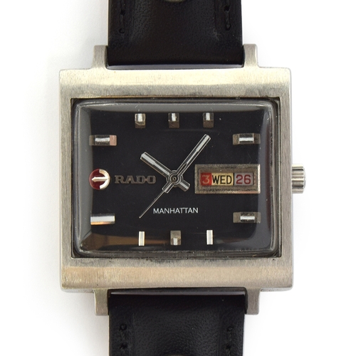 81 - A RARE GENTLEMAN'S STAINLESS STEEL RADO MANHATTAN DAY DATE WRIST WATCH 
CIRCA 1970s, matte black dia... 