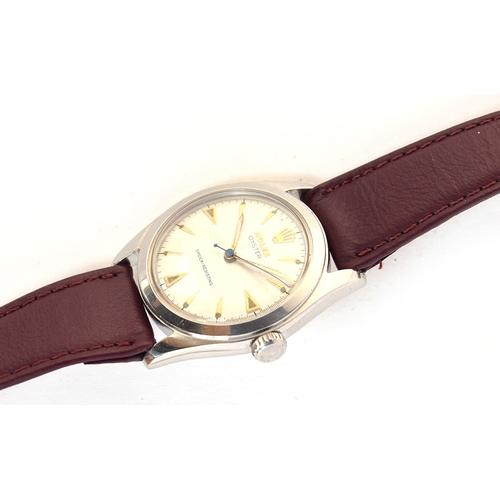 84 - A FINE STAINLESS STEEL ROLEX OYSTER WRIST WATCH
CIRCA 1955, REF 6082, PARCHMENT DIAL, GOLD ARROW HEA... 