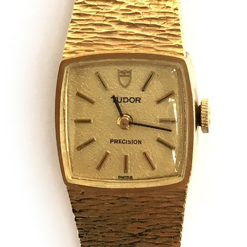 91A - A LADIES 9CT GOLD TUDOR PRECISION BRACELET WATCH
CIRCA 1970, gold coloured textured dial, baton mark... 