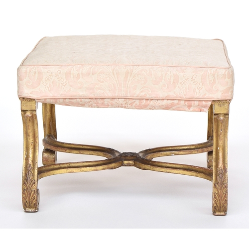 648 - A 19th century upholstered giltwood stool, on acanthus leaf carved scroll supports with carved X str... 