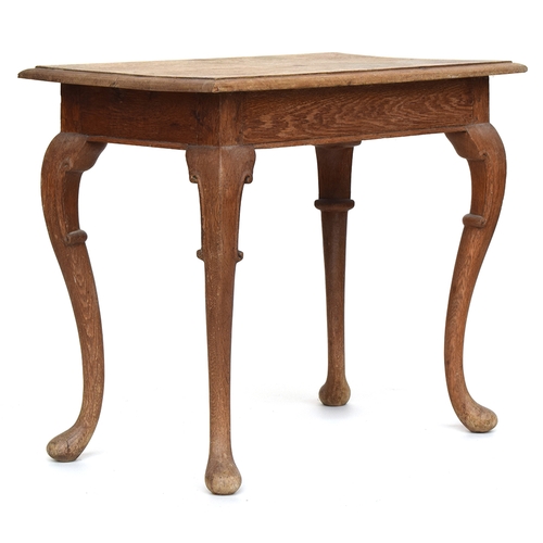 653 - A 19th century continental oak side table with moulded rectangular top on cabriole legs, 90x52.5x75.... 