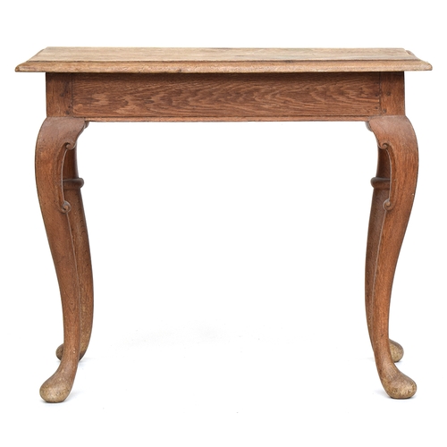 653 - A 19th century continental oak side table with moulded rectangular top on cabriole legs, 90x52.5x75.... 