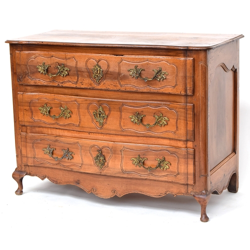 655 - A French 'provincial' walnut serpentine fronted chest, probably 18th century, of three long panelled... 