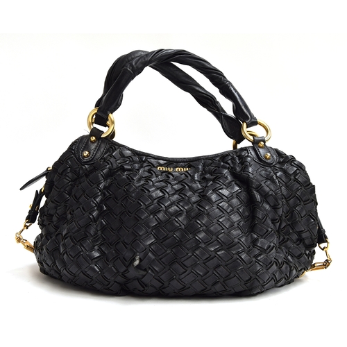 687 - Black woven leather handbag from Mui Mui, twisted leather handles attached with heavy brass hoops, z... 