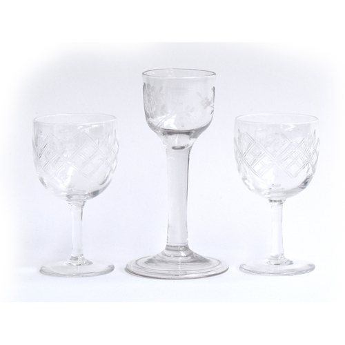 366 - A Georgian wine glass engraved with flowers, with plain stem above raised folded foot, together with... 