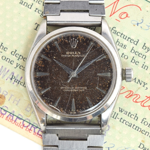 82 - A GENTLEMAN'S STAINLESS STEEL ROLEX OYSTER PERPETUAL WRIST WATCH
CIRCA 1958, REF 6564, BLACK TROPICA... 