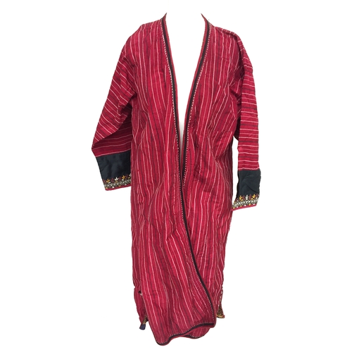 710 - Two silk Tekke Turkman coats, early 20th century, both of hand woven red striped silk, one with brai... 