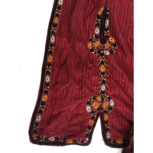 710 - Two silk Tekke Turkman coats, early 20th century, both of hand woven red striped silk, one with brai... 