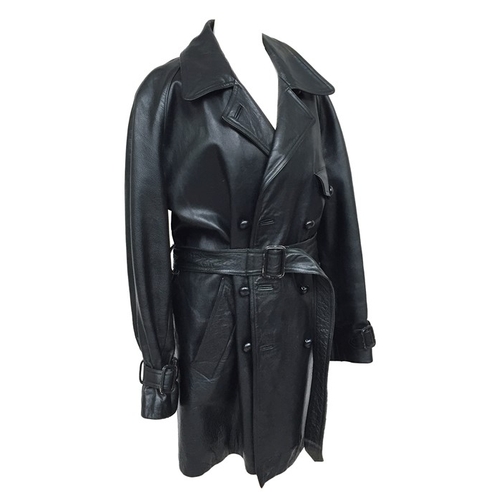 696 - A black leather coat from Katharine Hamnett, double breasted with leather buttons and quilted lining... 