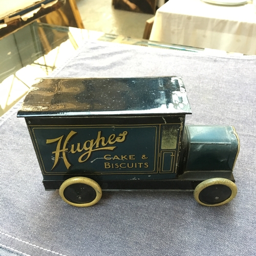 418 - An early tinplate clockwork flatbed lorry, red with yellow trim, in good condition, 18cmL, together ... 