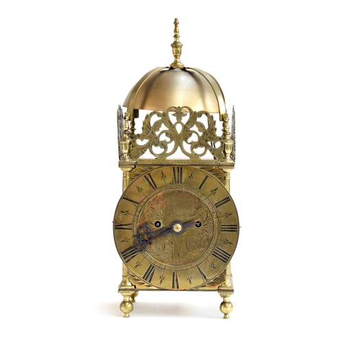 728 - A brass lantern clock by Roger Moore, Ipswich, circa 1685, surmouted by a strapped bell, five finial... 