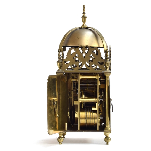 728 - A brass lantern clock by Roger Moore, Ipswich, circa 1685, surmouted by a strapped bell, five finial... 