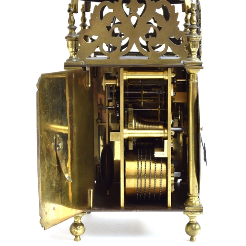 728 - A brass lantern clock by Roger Moore, Ipswich, circa 1685, surmouted by a strapped bell, five finial... 