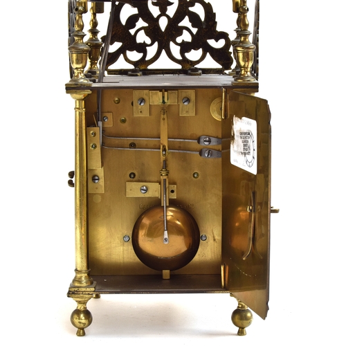 728 - A brass lantern clock by Roger Moore, Ipswich, circa 1685, surmouted by a strapped bell, five finial... 