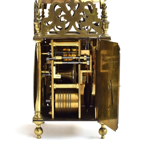 728 - A brass lantern clock by Roger Moore, Ipswich, circa 1685, surmouted by a strapped bell, five finial... 