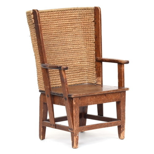 483 - A small child's Orkney chair, wooden frame with curved rush back, 54cm wide, 80cm high