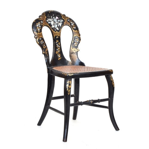 505 - An early 20th century ebonised papier-mache occasional chair with abalone inlay and cane seat