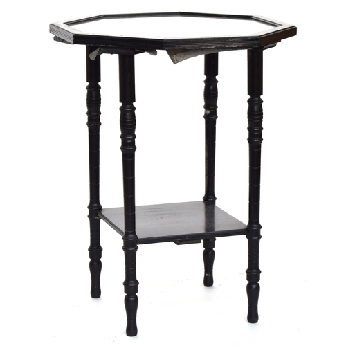 506 - An ebonised octagonal occasional table with undershelf, the glass top with nine Indian paintings of ... 