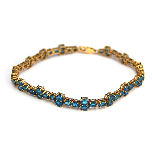 82 - A 10ct blue stone bracelet, gross weight 10.3g