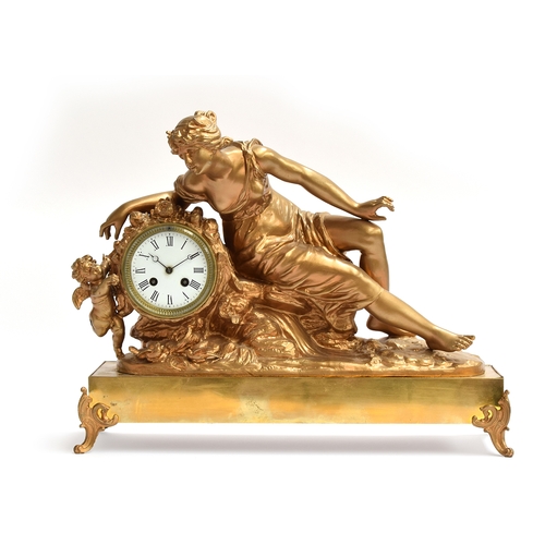 730 - A 19th century French gilt metal ormolu style figural mantel clock, in the form of a reclining lady ... 