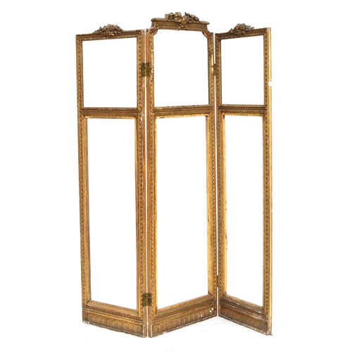 508 - A 19th century French carved giltwood three panel screen frame, 174cm high