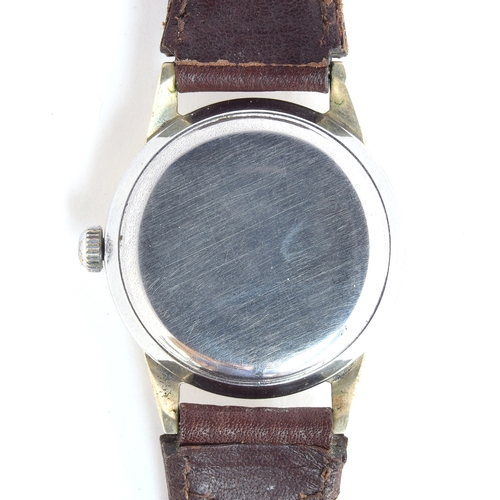 610 - A MOVADO GENTLEMAN'S STEEL AUTOMATIC WRIST WATCH
Circa 1950s, ref. 36111, cream patinated dial with ... 