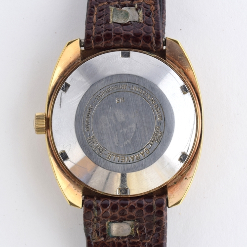 580 - A CARAVELLE GENTLEMAN'S STEEL AND GOLD PLATED AUTOMATIC DAY DATE WRIST WATCH
Circa 1960s, ref. 7540-... 