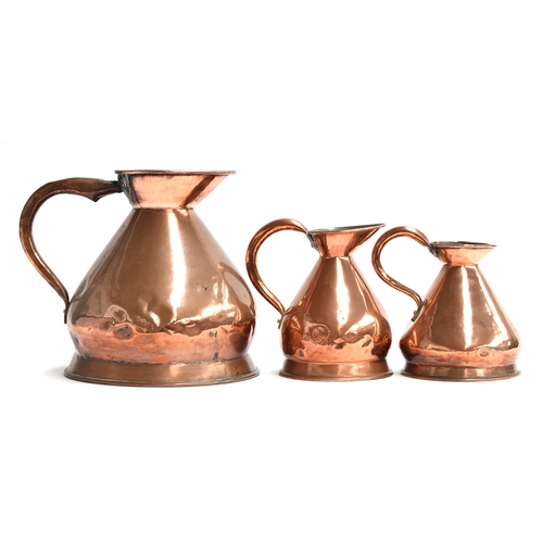 490 - A set of three copper haystack measures, one two gallon, two half gallons