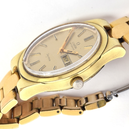 521 - AN OMEGA GENEVE GOLD PLATED AUTOMATIC DAY DATE GENTLEMAN'S WRIST WATCH
Circa 1970s, champagne dial, ... 