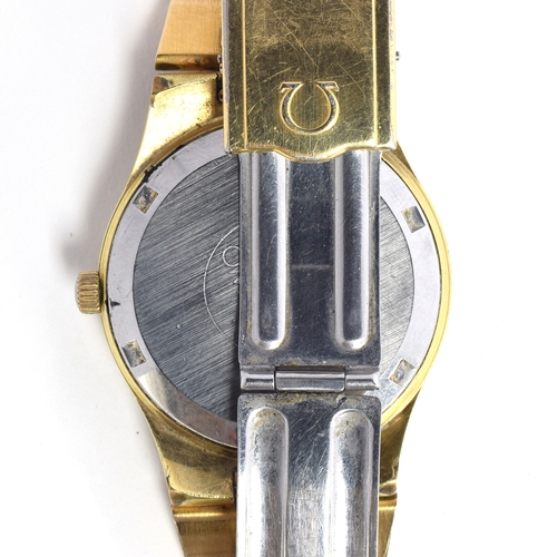 521 - AN OMEGA GENEVE GOLD PLATED AUTOMATIC DAY DATE GENTLEMAN'S WRIST WATCH
Circa 1970s, champagne dial, ... 