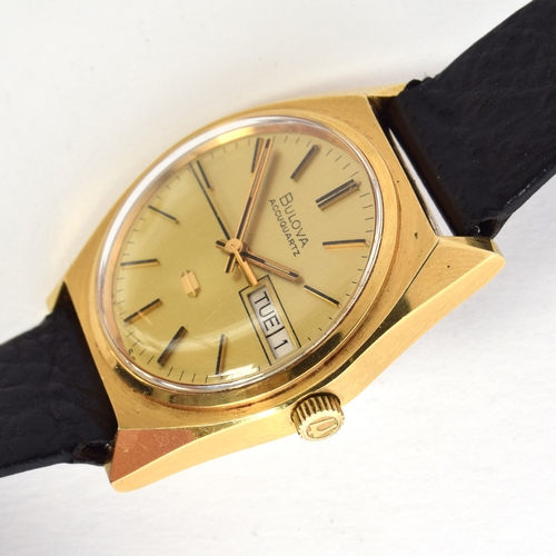 585 - A BULOVA ACCUQUARTZ GOLD FILLED WRIST WATCH
Circa 1974, champaign dial, raised baton markers, transi... 