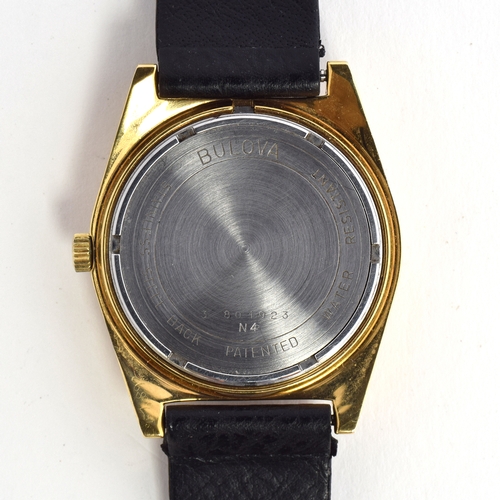 585 - A BULOVA ACCUQUARTZ GOLD FILLED WRIST WATCH
Circa 1974, champaign dial, raised baton markers, transi... 