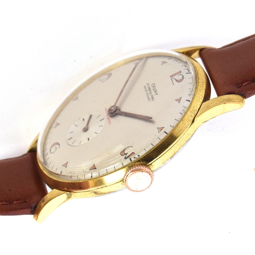 705 - A CAUNY STEEL AND GOLD PLATED OVERSIZED GENT'S WATCH
Circa 1950s, silvered dial, DECO Arabic numbers... 