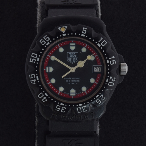 566 - A TAG HEUER FORMULA 1 GENTLEMAN'S QUARTZ WATCH
black dial with red outer ring, luminous dot hour mar... 