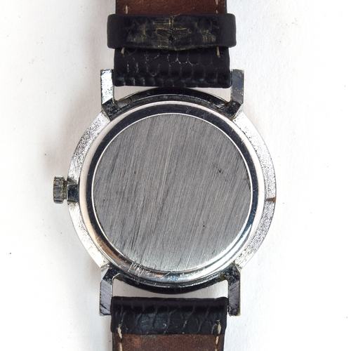 625 - A SMITHS 1950s GENT'S STEEL WATCH
Silvered fancy engine turned dial, raised Arabic numerals on evens... 