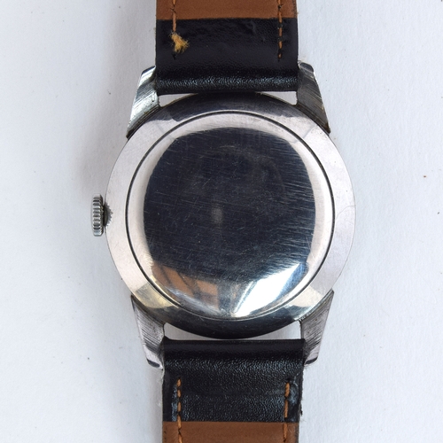 709 - A CYMA GENTLEMAN'S STEEL AUTOMATIC WRIST WATCH
Circa 1950s, two tone silvered dial with painted Arab... 