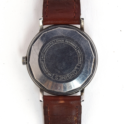 577 - A LONGINES GENTLEMAN'S STEEL AUTOMATIC WRIST WATCH
Circa 1960s, silvered dial with raised silver bat... 