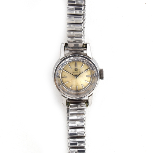 534 - AN OMEGA LADIES SAPHETTE STEEL WATCH
Silvered dial with raised baton markers, diamond cut crystal gl... 