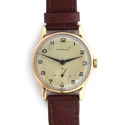 668 - A GARRARD 9CT GOLD GENTLEMAN'S WRIST WATCH
Circa 1950s, Arabic numerals and dagger hands
Movement: 1... 