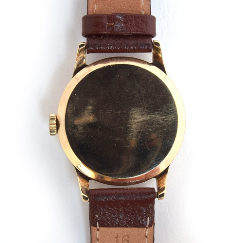 668 - A GARRARD 9CT GOLD GENTLEMAN'S WRIST WATCH
Circa 1950s, Arabic numerals and dagger hands
Movement: 1... 